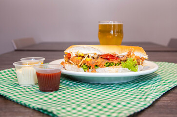 Delicious fresh beef strogonoff burger, with bread, beef, cheese, tomatoes, lettuce, egg, corns,...