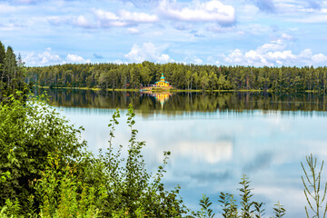 Fototapeta premium Landscape of Lake Roshchinskoe with the Church of the Holy Healer Panteleimon