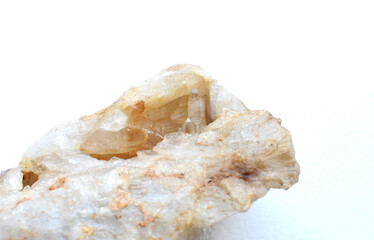 Cluster of natural quartz crystals on a white background.
