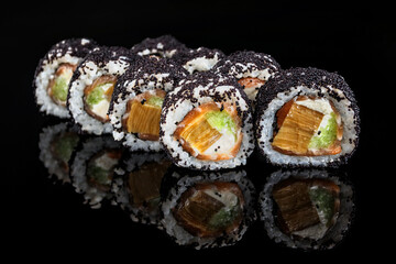 Sushi roll with salmon, cucumber, cream cheese and caviar
