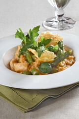 Asparagus risotto with pirarucu and fried cassava chips