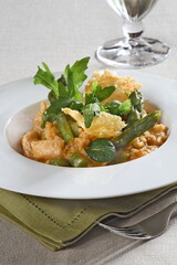 Asparagus risotto with pirarucu and fried cassava chips
