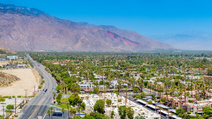 Aerial cityscape view of Cathedral City and Highway 111 during summer, looking towards Palm Springs