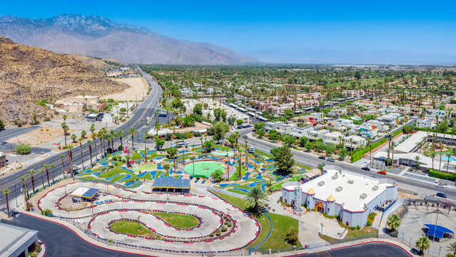 Aerial cityscape view of Cathedral City and Highway 111 during summer, looking towards Palm Springs