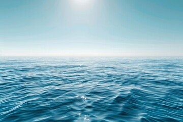Obraz premium A serene view of a calm ocean under a clear blue sky