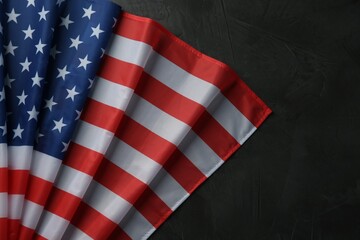 Flag of USA on black table, top view. Space for text