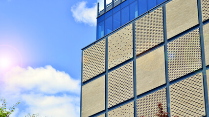 Obraz premium Facade of building with modern elements. Exterior of a modern industrial building. 