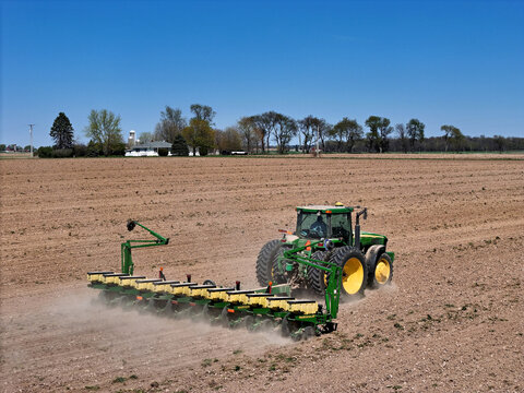 LeRoy, ILLINOIS - April 25. 2024: John Deere 8120 tractor pulling a John Deere 1760 12 row planter