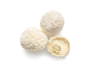 Delicious chocolate candies with coconut topping isolated on white background
