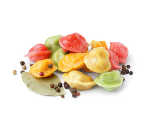 Boiled colorful dumplings with peppercorn and bay leaf on white background