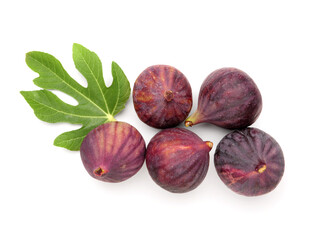 Fresh ripe figs and leaf on white background