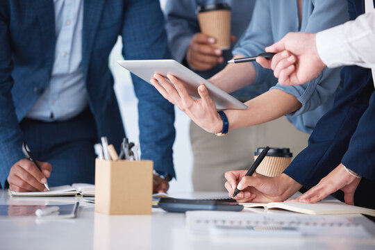 Hands, tablet and business people by table with planning team schedule and collaboration meeting in office. Tech, employee group and calendar app for project timeline with writing notes and support