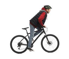 Naklejka premium Man in helmet riding bicycle on white background