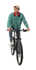 Smiling man with headphones riding bicycle on white background