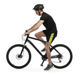 Naklejka premium Man in helmet riding bicycle on white background