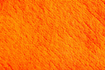 Closeup view of orange knitted fabric texture