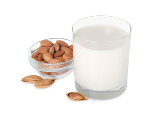 Glass of almond milk and almonds isolated on white