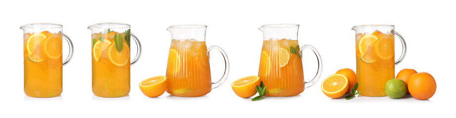 Glass jugs with refreshing orange drink isolated on white, set