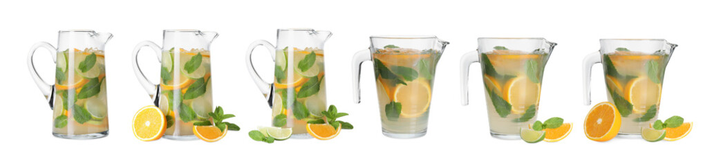 Glass jugs with refreshing citrus drink isolated on white, set