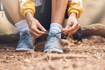 Hands, tie and sneakers for hiking outdoor for fitness travel, exercise and walking in forest for...