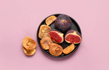 Plate with sweet dried figs and fresh fruits on purple background