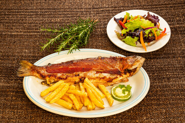 Rainbow trout from Tota Boyaca lake - Baked trout with fries. Colombian gastronomy