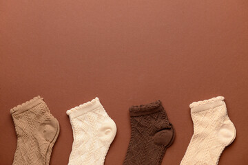 Different basic color socks on brown background