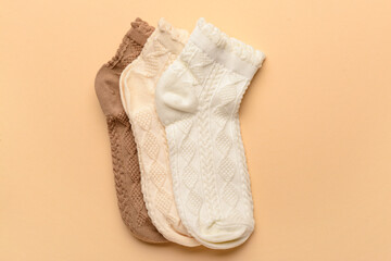 Different basic color socks on beige background