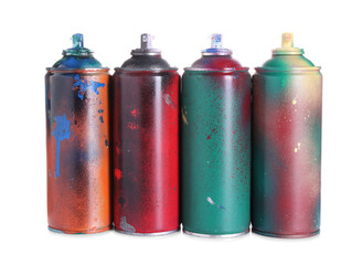 Many spray paint cans isolated on white
