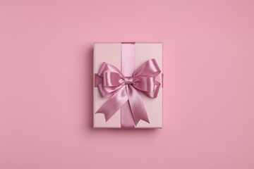 Beautiful gift box with color bow on pink background, top view