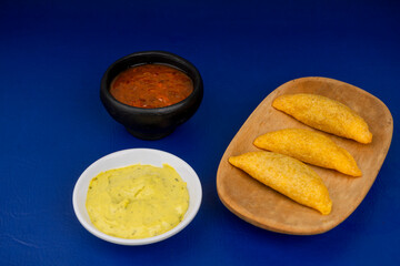 Delicious traditional Colombian empanadas with spicy sauce