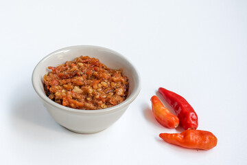 Indonesia traditional cuisine sambal bawang or spicy garlic chili sauce served on a white bowl isolated on white background.