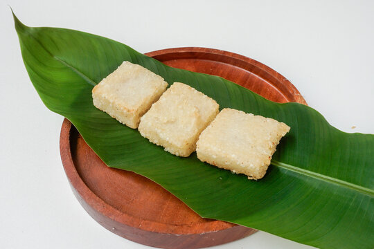 Jadah or Uli Ketan or ulen ketan goreng is a traditional Indonesian food made from sticky rice and grated coconut, fried on pan. Usually served as a tea time snack. Served on banana leaf