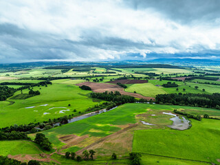 Obraz premium Farms and Fields over River Eden and River Eamont from a drone, Cumbria, England