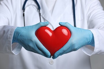 Doctor with red heart and stethoscope, closeup