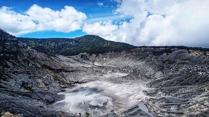 landscape of  limestone craters mountains and hills with blue sky background