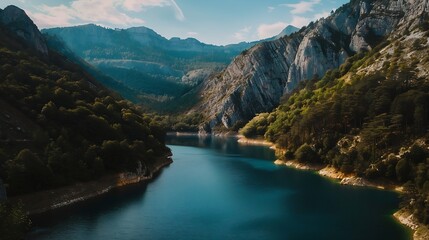 A picturesque lake nestled among towering mountains and lush trees seen from above showcasing a stunning natural landscape with water resources and fluvial landforms : Generative AI