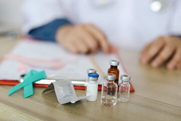 Teal Awareness, Medicine And Medical Bottle Against Blurred Professional Doctor Holding Medical Document Background