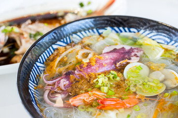 Seafood soup noodles bowl in the restaurant