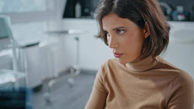 Worried lady complaining clinic having healthcare appointment office closeup. 