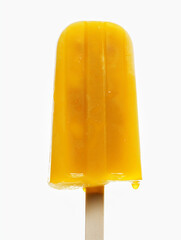 Exotic pineapple ice pop, a closeup of an exotic pineapple ice pop, its bright yellow color and icy texture standing out against a stark white backdrop