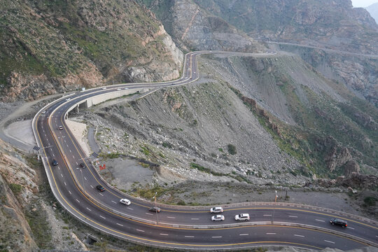 View of the city of taif or Ta'if with many mountains. You can see the winding road going down the hill from the telepherique, or seilbahn. Taif, Mecca Province, Saudi Arabia. 