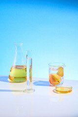 High angle shot at the table of lab containing some experiment tools like transparent measuring...