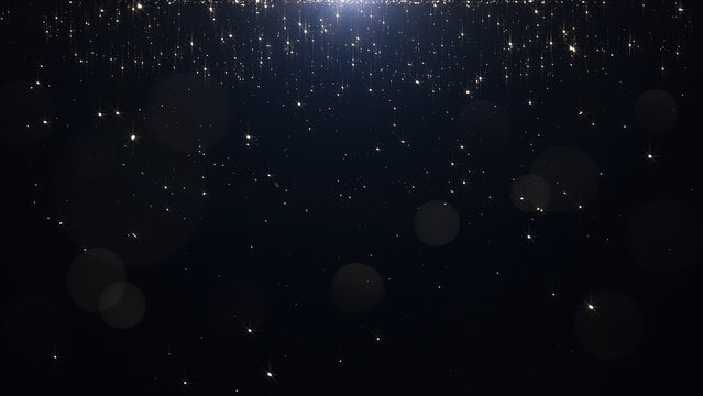 Glamorous golden particles on a black background