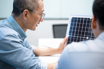 Fototapeta premium businessman coworking on solar panel