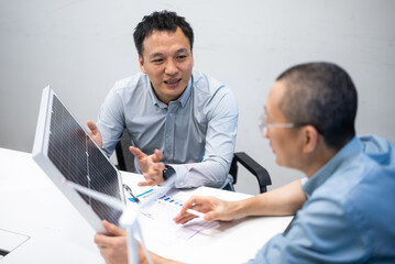 businessman coworking on solar panel