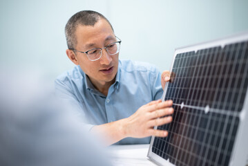 businessman coworking on solar panel