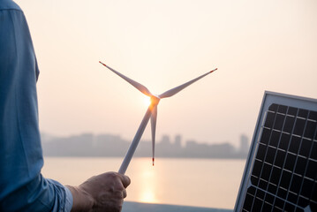 businessman talking on new energy by river