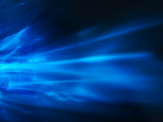 Blue glare in the dark for technology abstract background.
