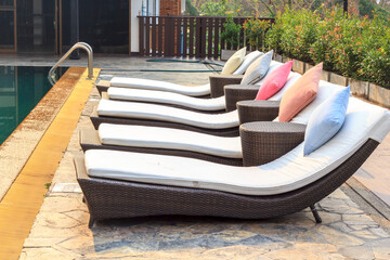 Colorful sunbed around the pool in Thailand